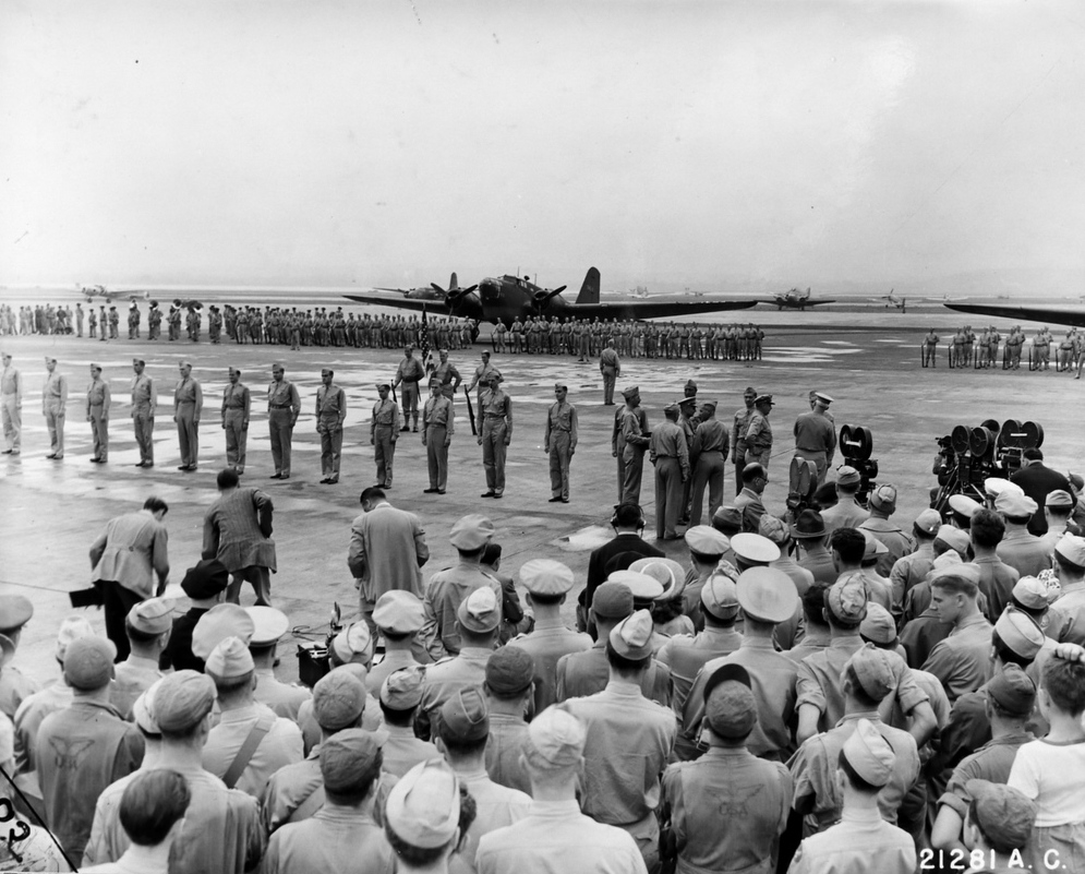 Henry Arnold awarding Doolittle Raiders at Bolling Field, Washington DC, United States, 27 Jun 1942; note B-18 Bolo aircraft in background