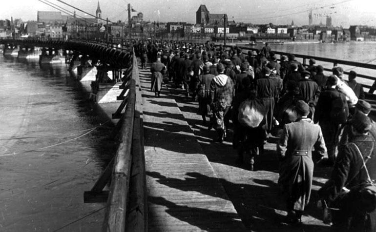 German prisoners of war marched across a bridge, Königsberg, Apr 1945