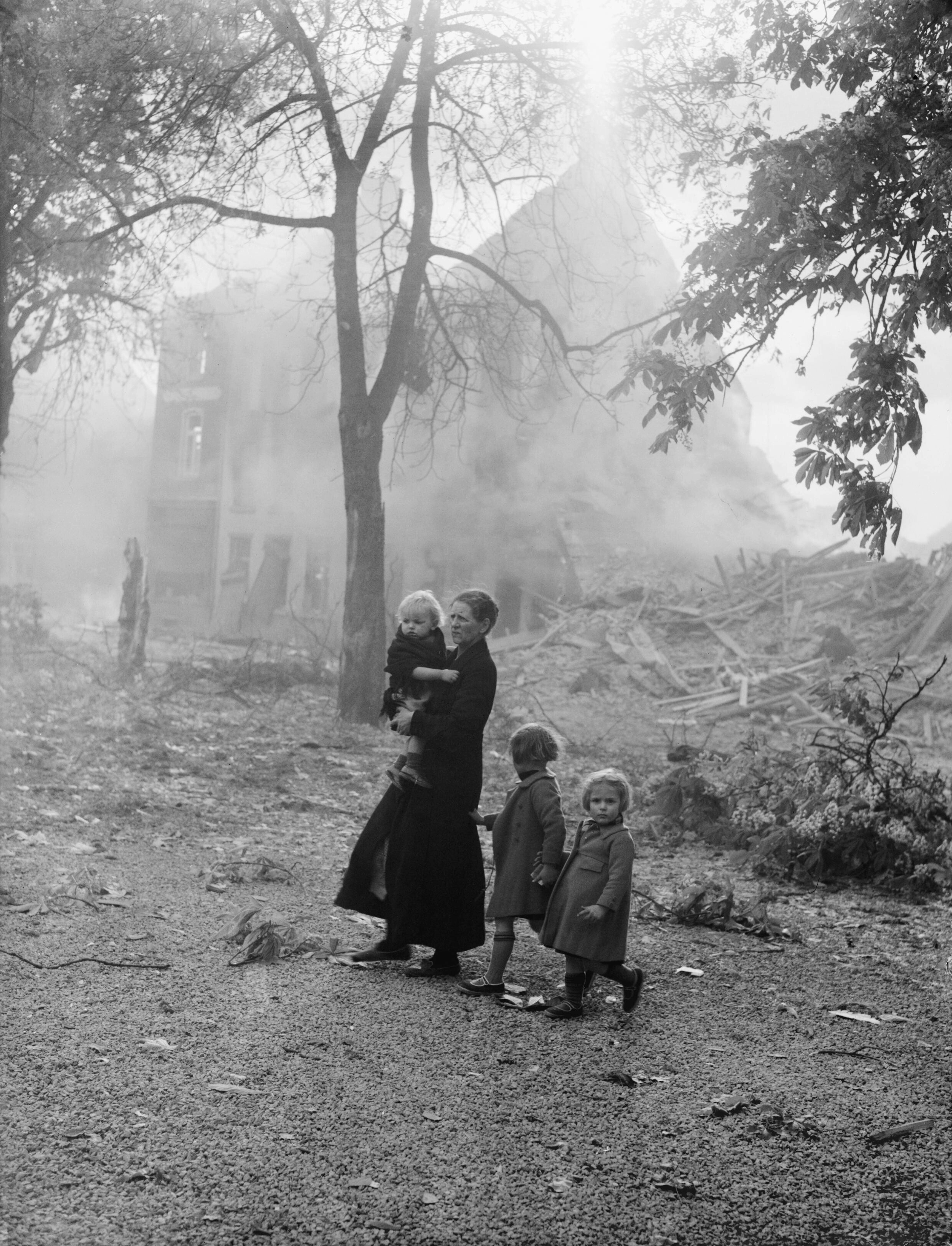 A Dutch family amidst a devastated town after the German invasion, May 1940
