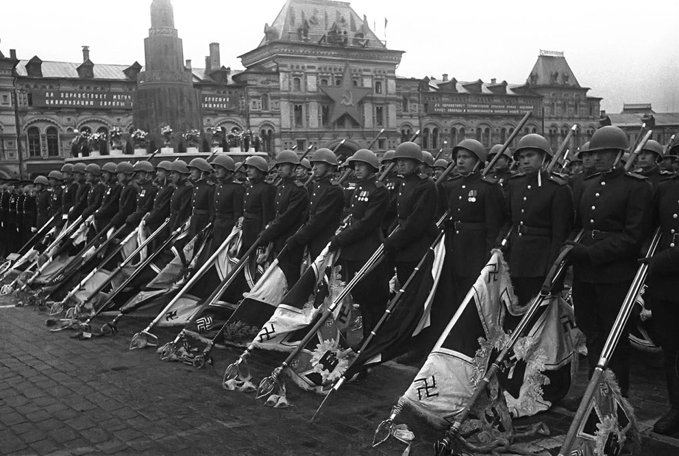 Soviet soldiers lowering German flags during the Victory Day Parade, Moscow, Russia, 24 Jun 1945