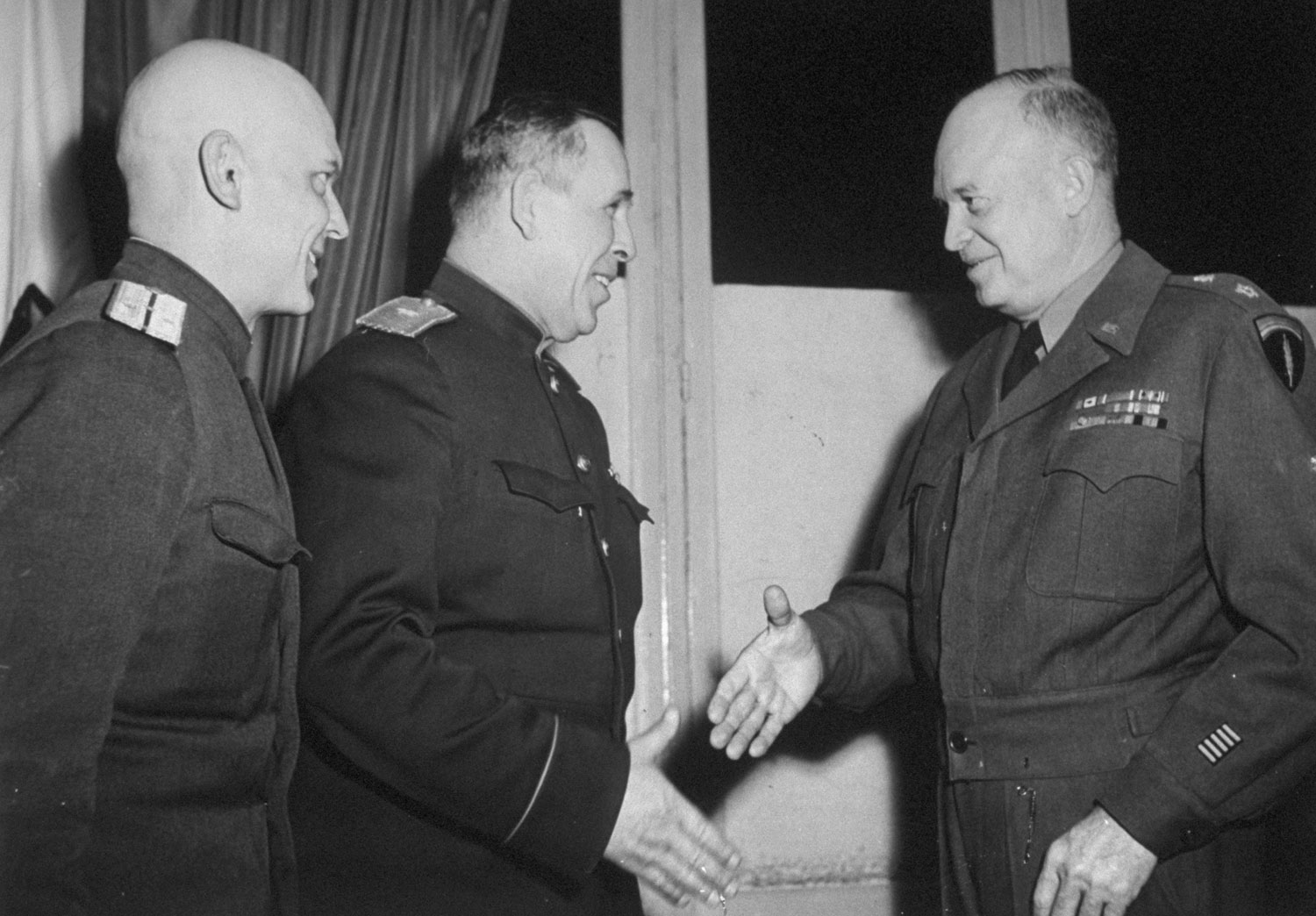 After Germany’s surrender papers were signed at Reims, France 7 May 1945, Soviet General Ivan Susloparov and his aide met with Supreme Allied Commander Dwight Eisenhower.
