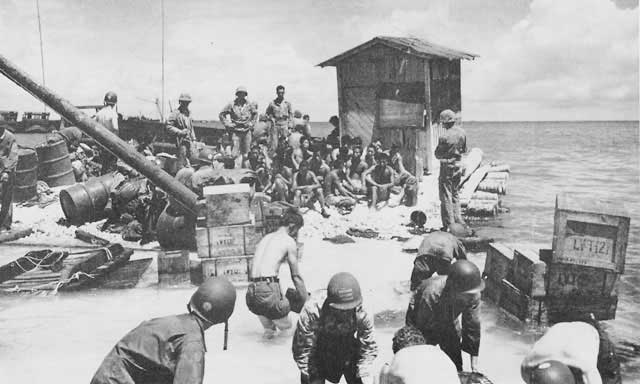 Japanese POWs put to work as laborers for USMC, Betio, Tarawa Atoll, 22 Nov 1943