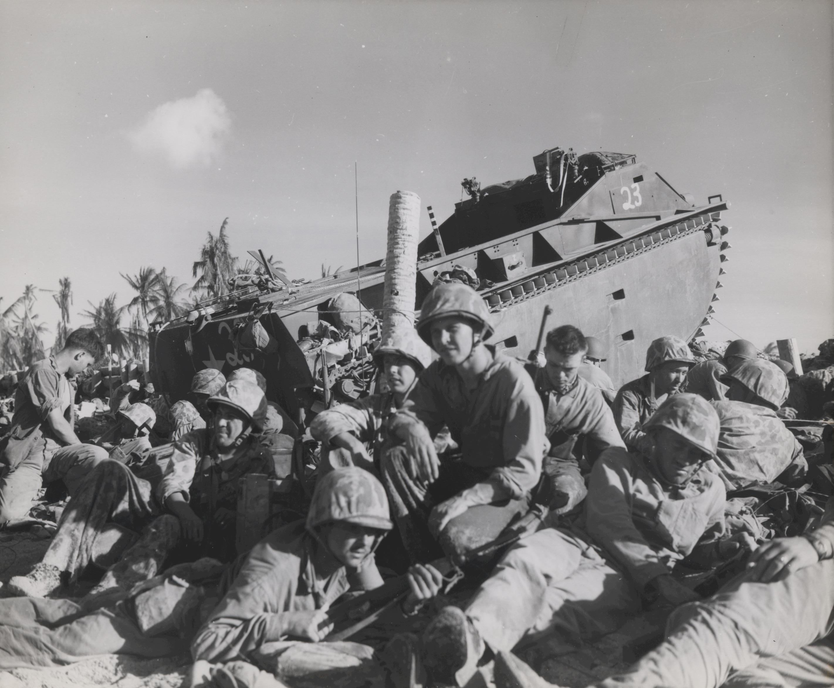 US Marines resting near an amphibian tractor, Tarawa, Gilbert Islands, Nov 1943