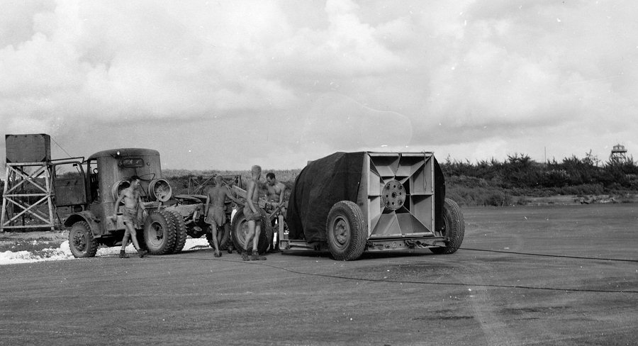 'Fat Man' bomb arriving at the airfield on Tinian, Mariana Islands, Aug 1945, photo 1 of 2
