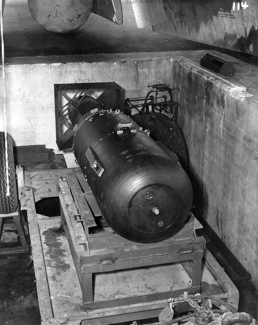 'Little Boy' bomb in a bomb pit, ready to be loaded onto B-29 bomber 'Enola Gay', Tinian, Mariana Islands, 6 Aug 1945, photo 3 of 3