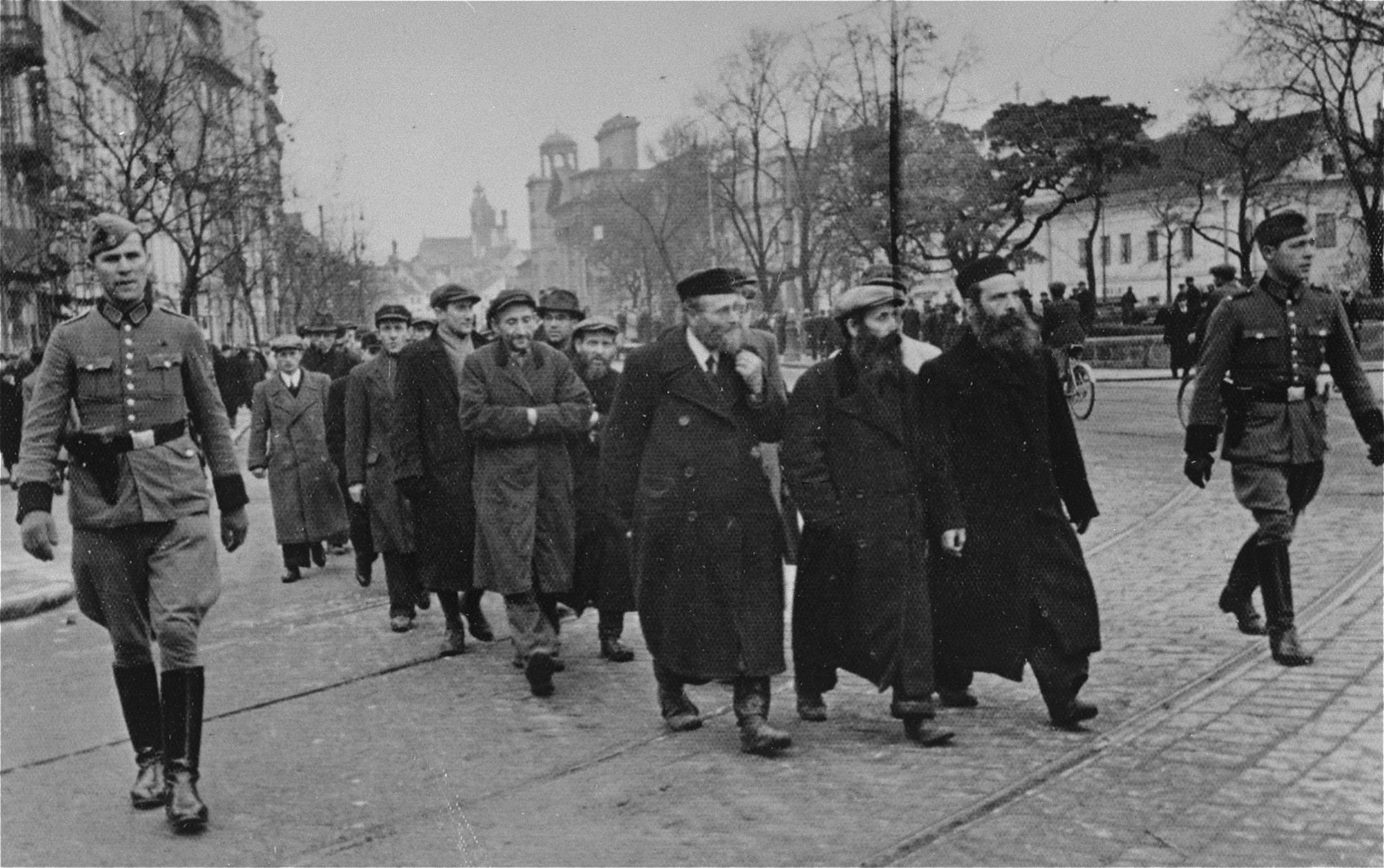 Polish Jews being gathered by German police as forced laborers, Warsaw, Poland, Mar 1940