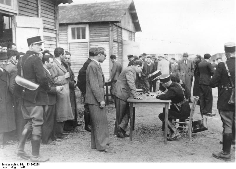 French police checking in new Jewish prisoners arriving at the Pithiviers transit camp in France, 1941