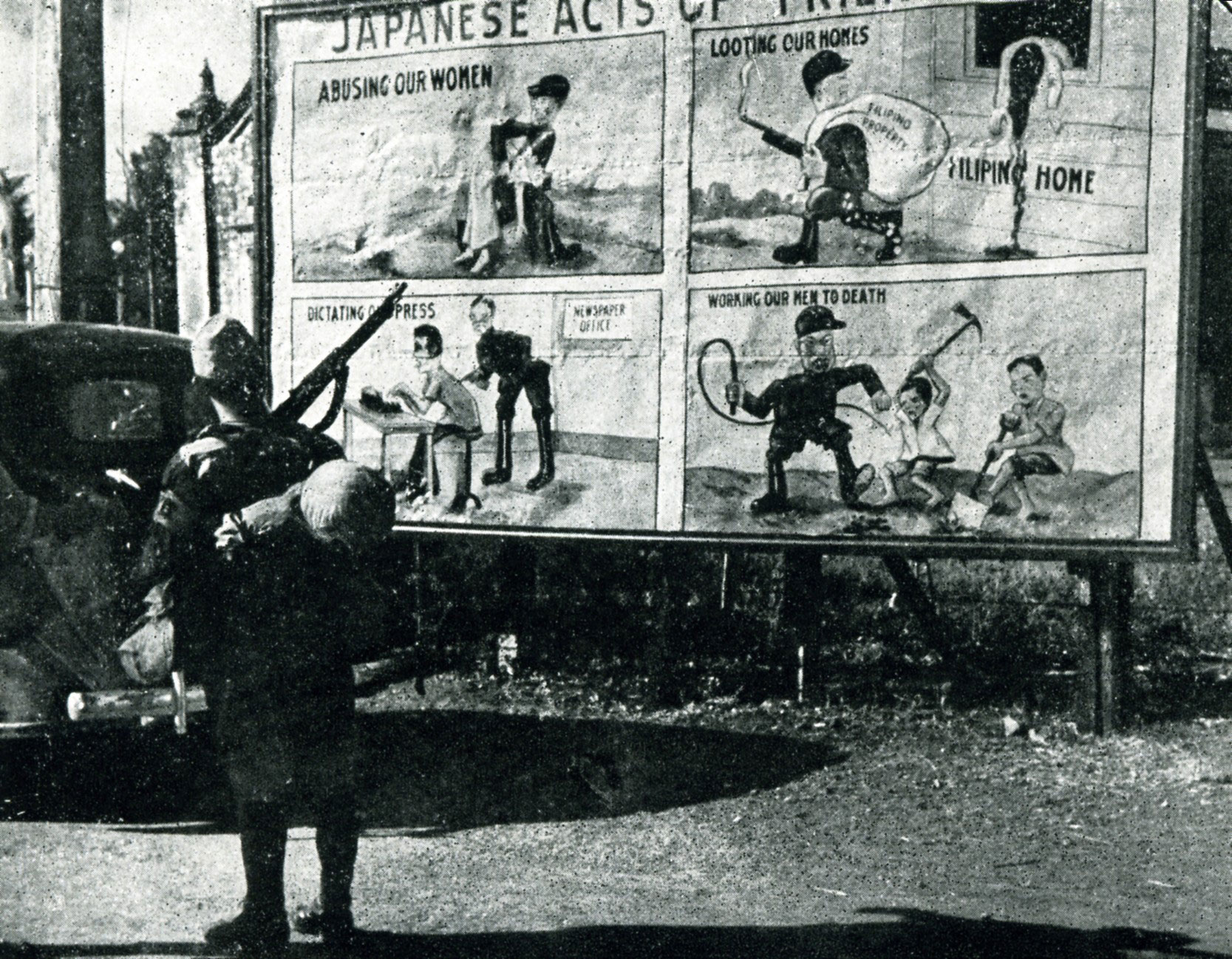 A Japanese soldier passing by American propaganda, circa 1942