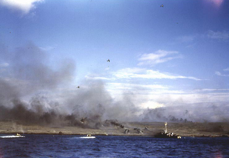 A LCS(L) and three Corsair aircraft bombarded an Iwo Jima Beach as two LVTs moved toward shore, 19 Feb 1945