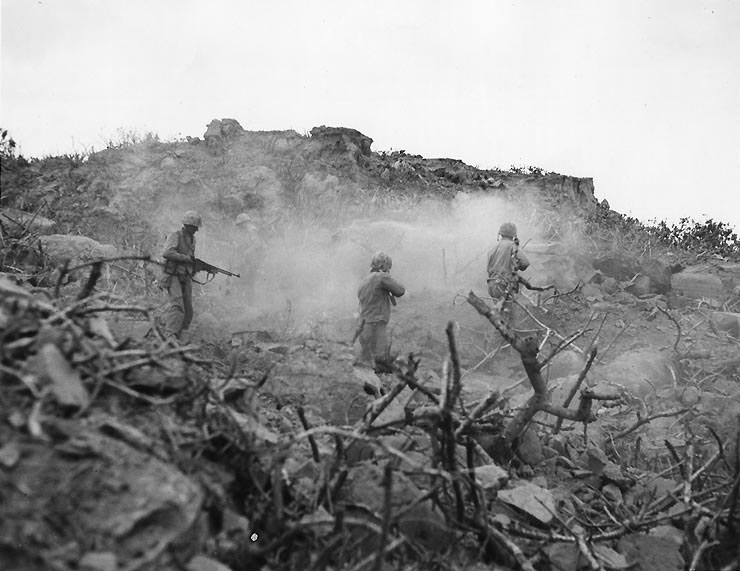 Four US Marines cleared out a cave with BAR, small arms, and grenades, Iwo Jima, circa Feb-Mar 1945