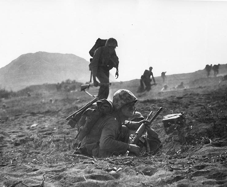 US Marine communicators dashed for cover, Iwo Jima, Japan, Feb 1945
