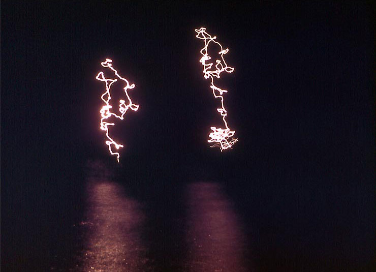 Starshells or other pyrotechnics over Iwo Jima, night of 19 Feb 1945, photo 1 of 2