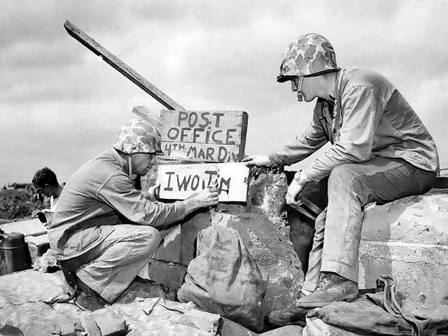 US Marines Sergeant B. D. Boyant and Corporal Kenneth E. Hales setting up the 4th Marine Division's post office on Iwo Jima, late Feb 1945