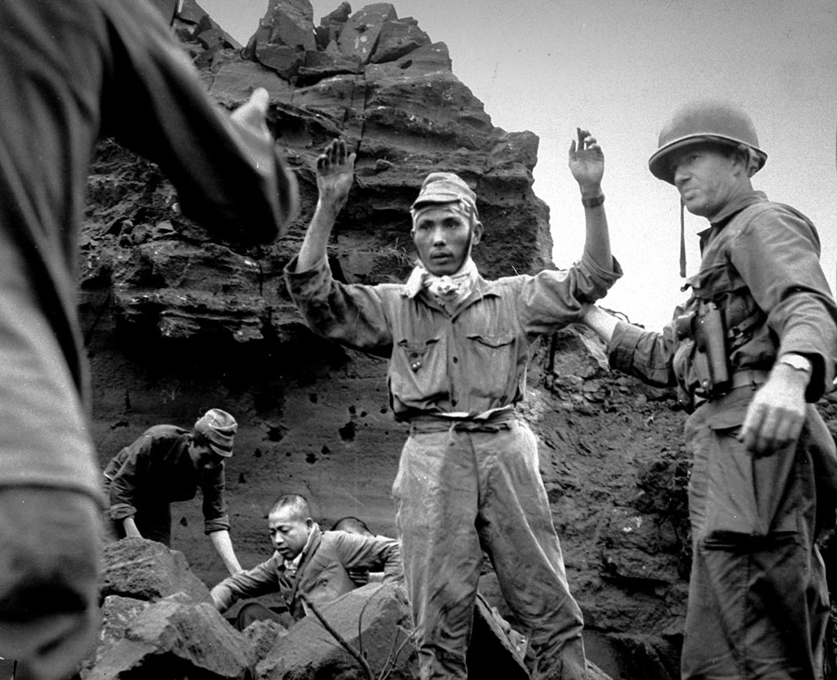 Japanese troops being captured by Americans on Iwo Jima, Japan, 5 Apr 1945