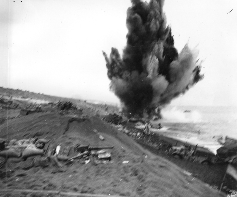 US military using demolition charges to clear destroyed vehicles from Iwo Jima beach, Japan, 21 Feb 1945