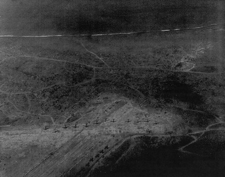 View of an airfield on Iwo Jima, Japan, 7 Mar 1945; photo taken from an aircraft of USS Anzio