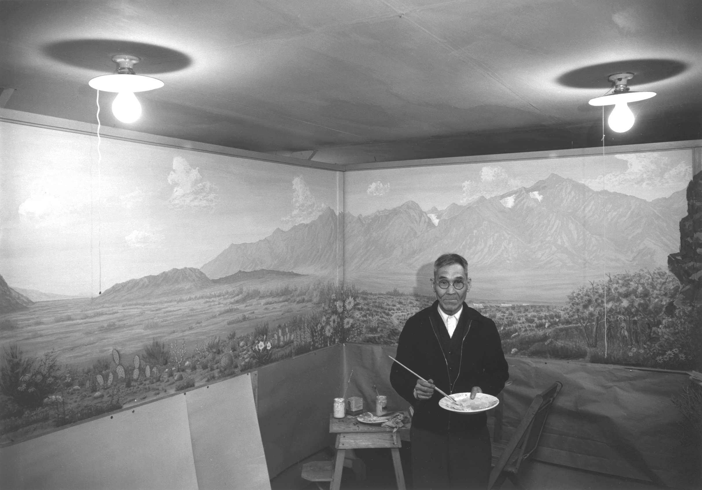 Japanese-American artist C. T. Hibino at the Manzanar Relocation Center, California, United States, 1943
