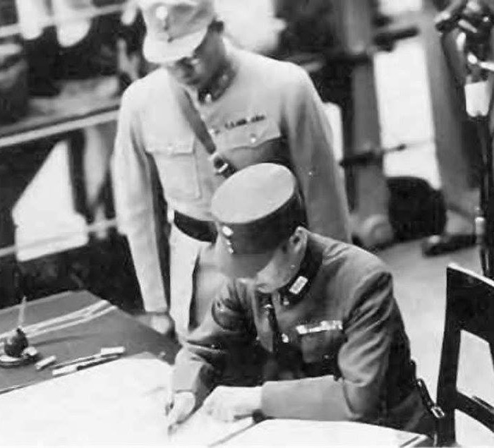 Xu Yongchang signing the surrender document on behalf of China aboard USS Missouri, Tokyo Bay, Japan, 2 Sep 1945, photo 3 of 5