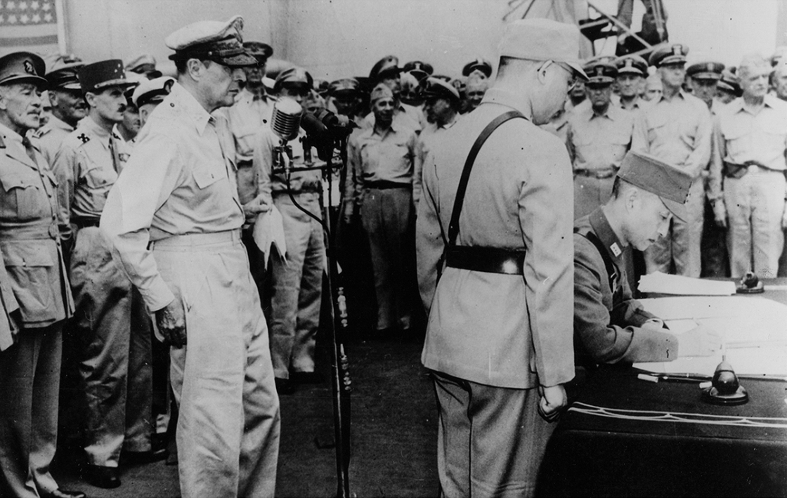 Xu Yongchang signing the surrender document on behalf of China aboard USS Missouri, Tokyo Bay, Japan, 2 Sep 1945, photo 4 of 5