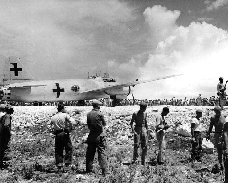 Aboard two Mitsubishi G4M ‘Betty’ bombers in surrender markings, a Japanese delegation stopped at Ie Jima, Ryukyu Islands en route Manila, Philippines for a surrender briefing, 19 Aug 1945. Photo 06 of 12.