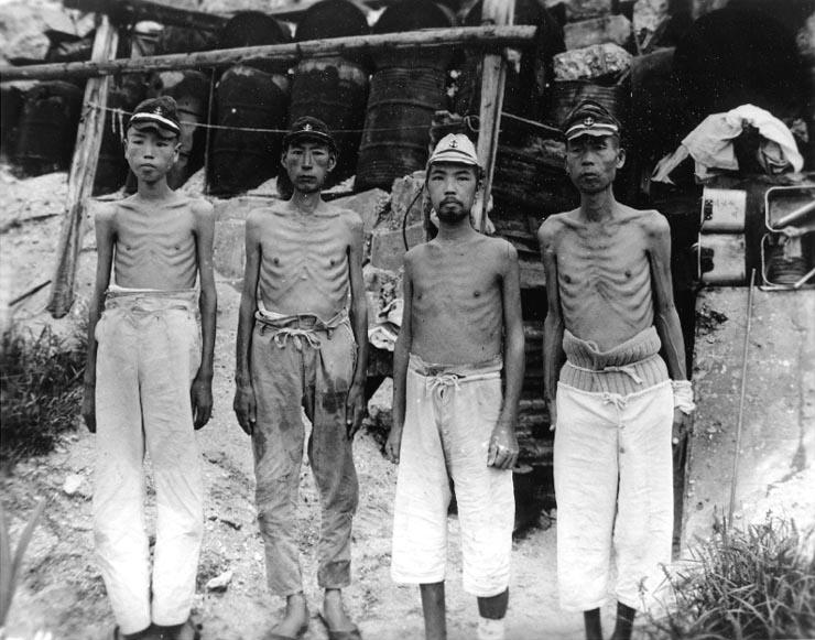 Emaciated Japanese naval personnel at Marshall Islands after Japan's surrender, probably Wotje or Maloelap, 15 Sep 1945