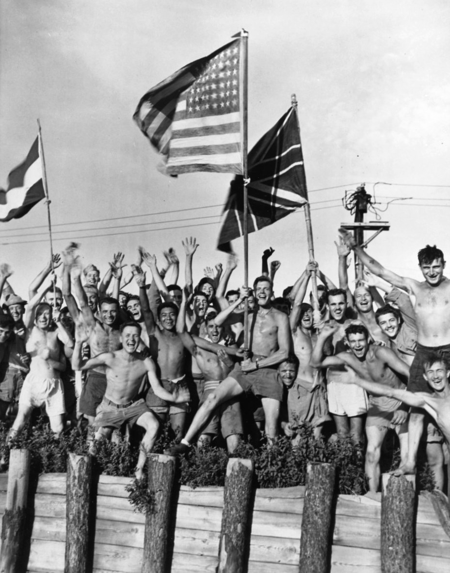 Allied prisoners of war at Aomori camp near Yokohama cheered as US Navy and other Allied personnel arrived to rescue them, 29 Aug 1945