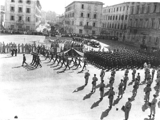 Japanese-American soldiers marching in the V-J Day parade, Livorno, Italy, Sep 1945