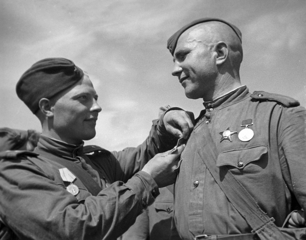 A Soviet soldier being awarded the Defense of Leningrad medal, 1 Jun 1944