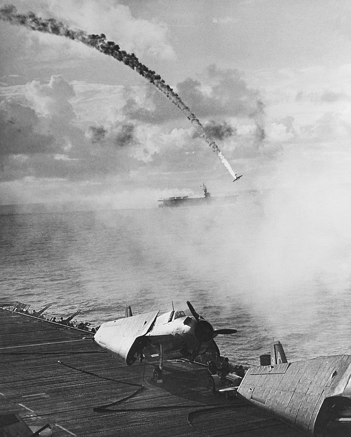 Japanese aircraft being shot down as it attempted to attack escort carrier Kitkun Bay, near Marianas Islands, Jun 1944, photo 2 of 2