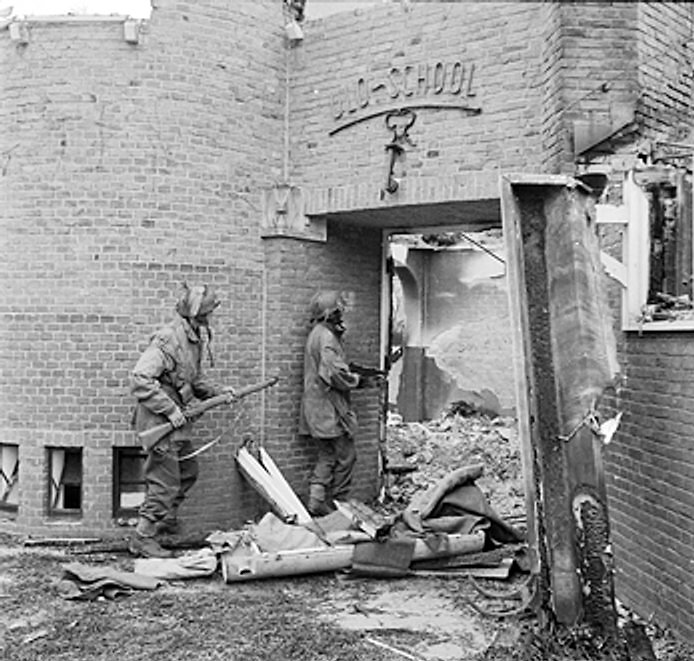Sergeant J. Whawell and Sergeant J. Turl of the UK Glider Pilot Regiment searching a damaged ULO school for German snipers, Kneppelhoutweg, Oosterbeek, Gelderland, the Netherlands, 21 Sep 1944