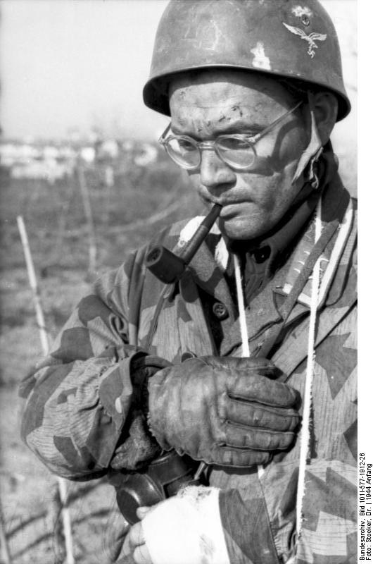 German paratrooper sergeant smoking a pipe, Monte Cassino, Italy, early 1944