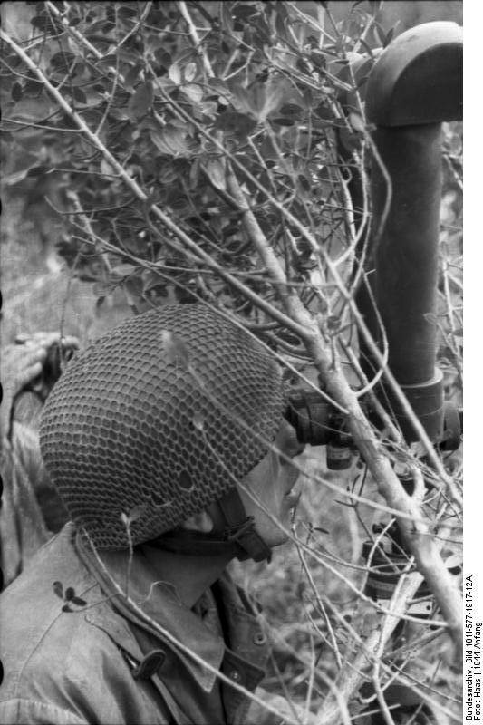 German paratrooper observing the field, Monte Cassino, Italy, early 1944