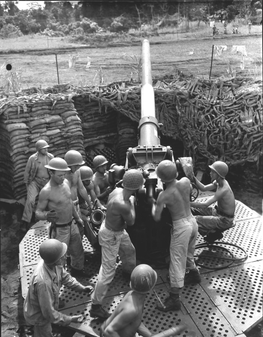 US Army anti-aircraft gun crew manning their 3-inch M3 AA gun at New Fighter Strip, Dobodura, New Guinea, 17 May 1943