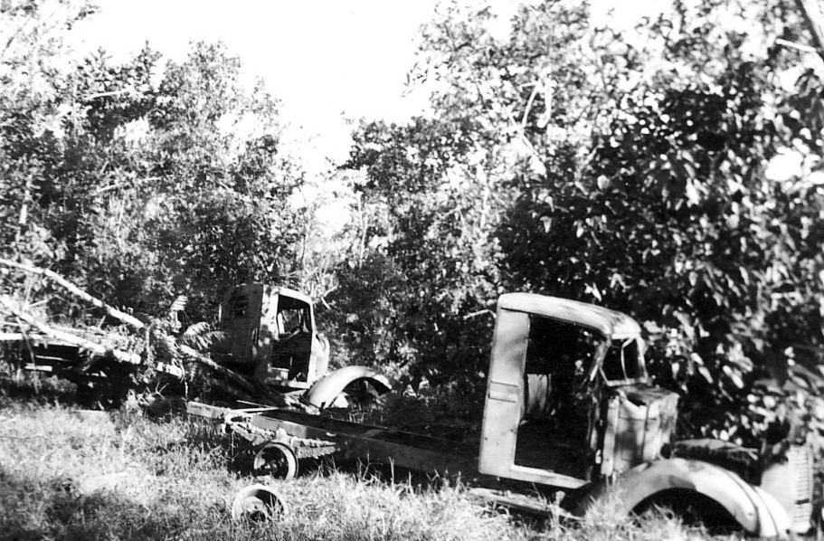 Destroyed Japanese trucks, Buna, Australian Papua, mid-1943
