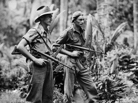 Australian Privates Leon Ravet of Parramatta and Bernard Kentwell on patrol with Owen Machine Carbines, New Britain. 4 April 1945