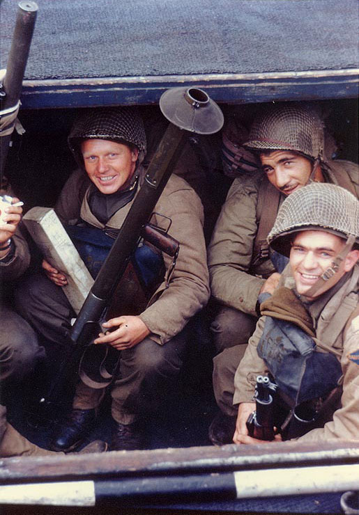 US Army Rangers awaited the invasion signal in a landing craft in an English port, circa early Jun 1944, photo 1 of 2; note the bazooka and the M1 Garand rifles