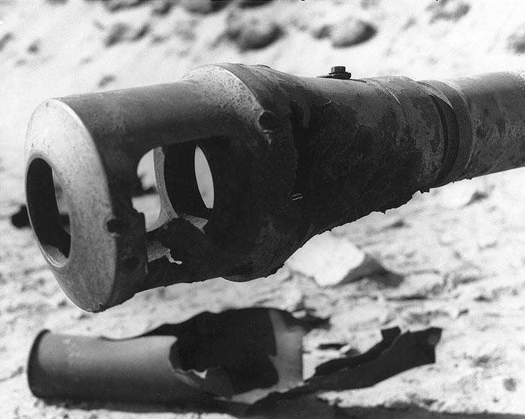 Damaged muzzle brake of a German 88mm gun, located in one of Utah Beach's gun emplacements; photo taken on 15 Sep 1944