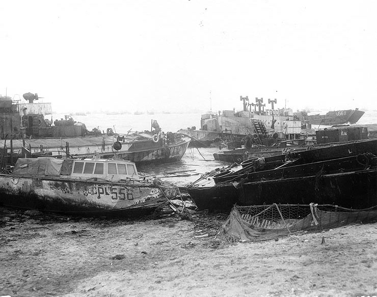 Wrecked American and British landing craft after a storm, Omaha Beach, Normandy, 21 Jun 1944