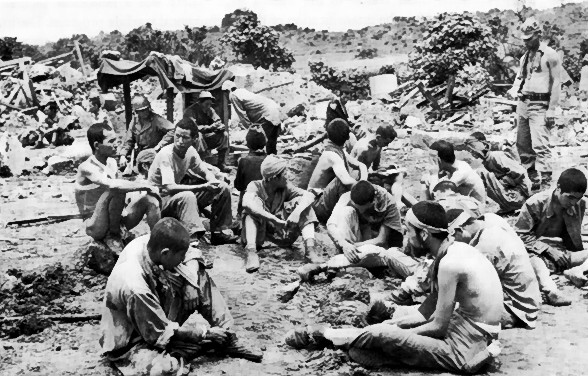 A group of Japanese prisoners, Okinawa, Japan, circa Jun 1945