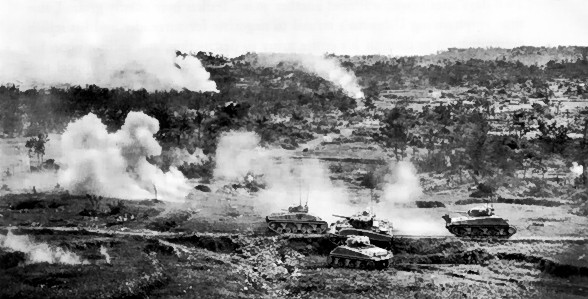 M4 Sherman tanks operating on Okinawa, Japan, circa Jun 1945; note tank in center had been disabled