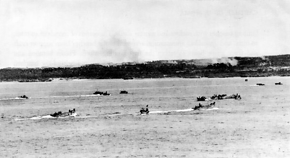 US Army troops aboard LCVP landing craft sailing toward invasion beaches on Ie Shima, Okinawa, Japan, 16 Apr 1945