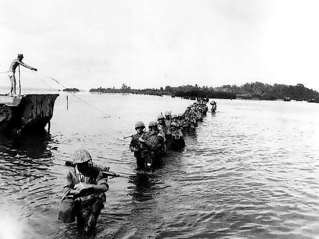 US Marines wading through water, Peleliu, Palau, Sep 1944