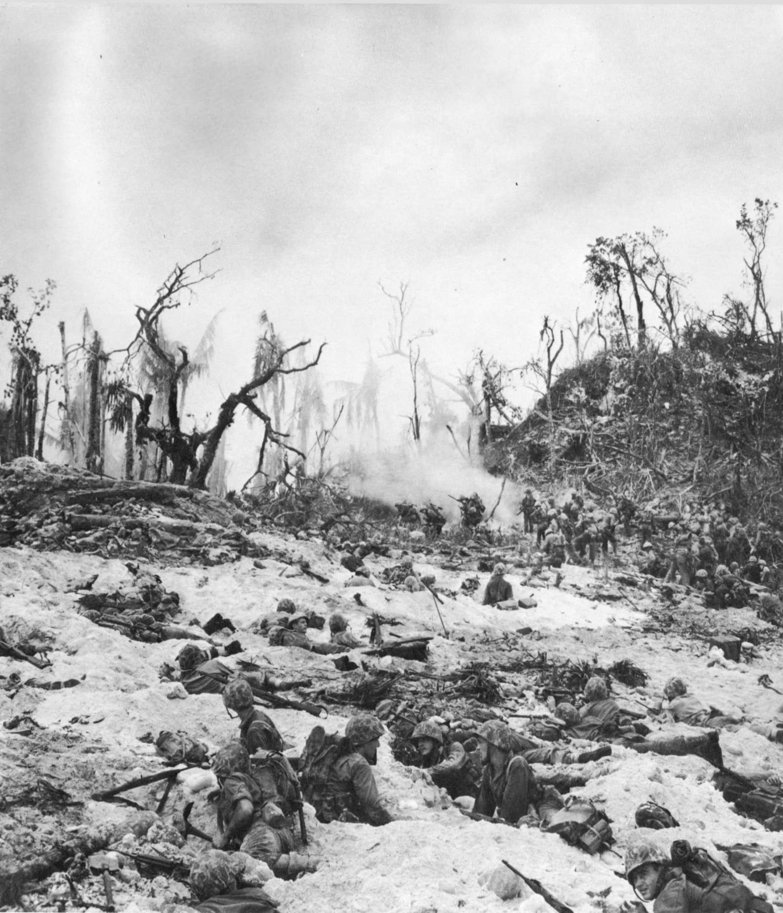 Men of the US 1st Marine Division fighting just beyond White Beach, Peleliu, 15 Sep 1944, photo 1 of 2