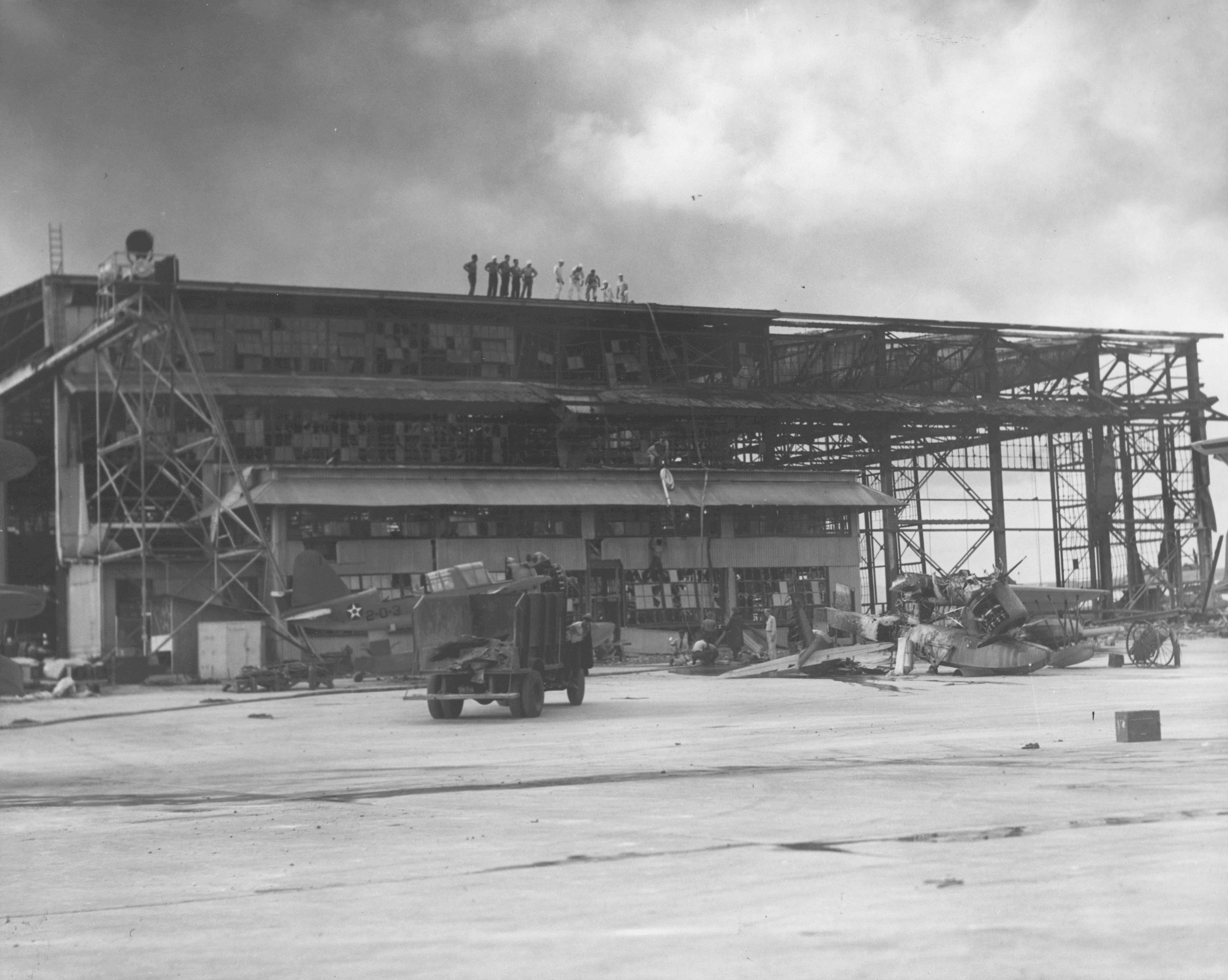Wrecked hangar building and two damaged OS2U aircraft, Naval Air Station Ford Island, Oahu, US Territory, 8 Dec 1941