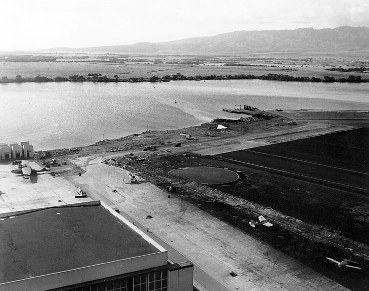 View of Naval Air Station Ford Island, Oahu, US Territory of Hawaii, 8 Dec 1941; note OS2U, SOC, PBY-5, F4F-3, and TBD-1 aircraft