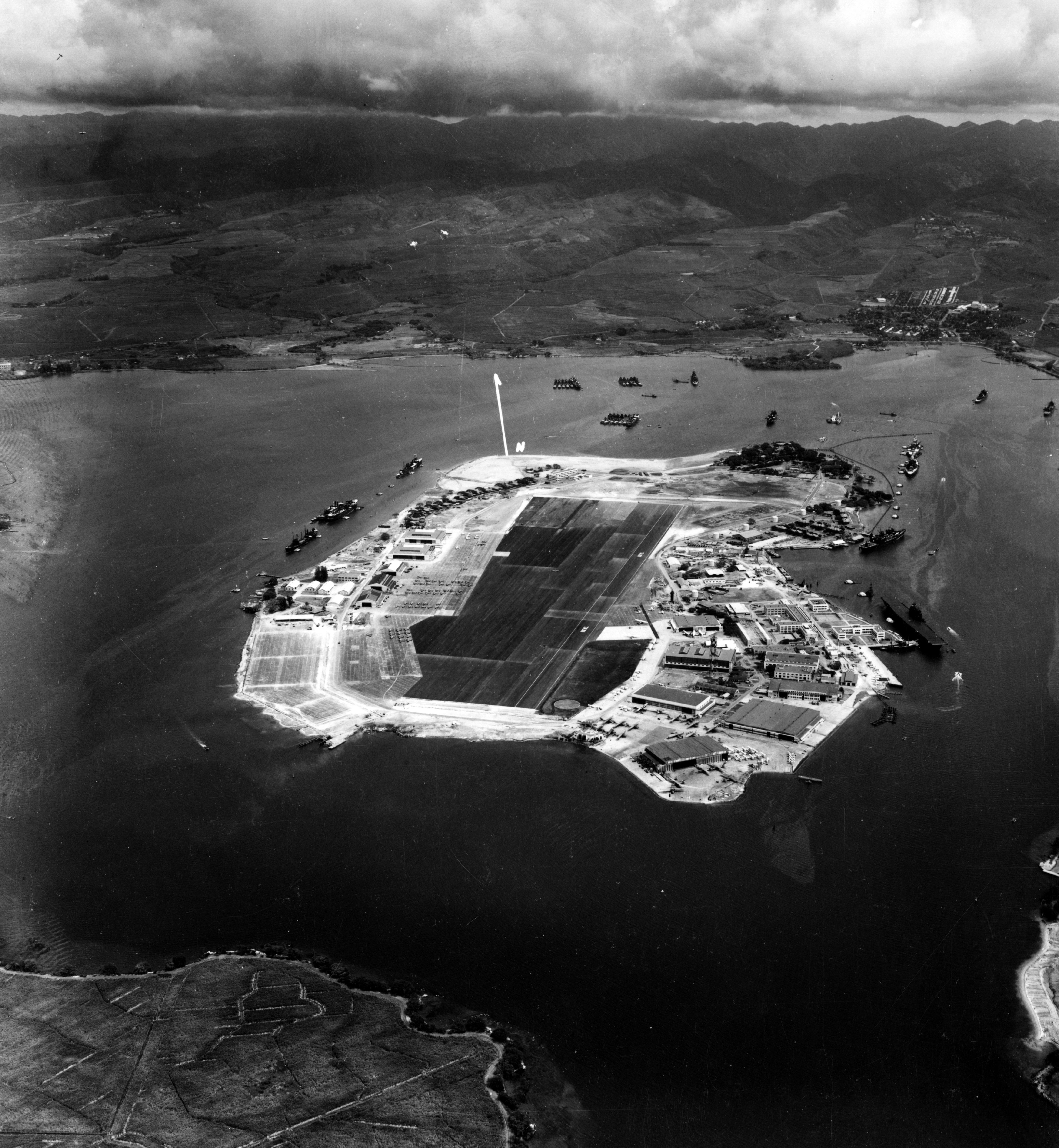 Ford Island, Pearl Harbor, Oahu, US Territory of Hawaii, Oct 10, 1941. Carrier Enterprise and Repair Ship Curtiss are moored alonfside Ford Island on the right of the photograph.