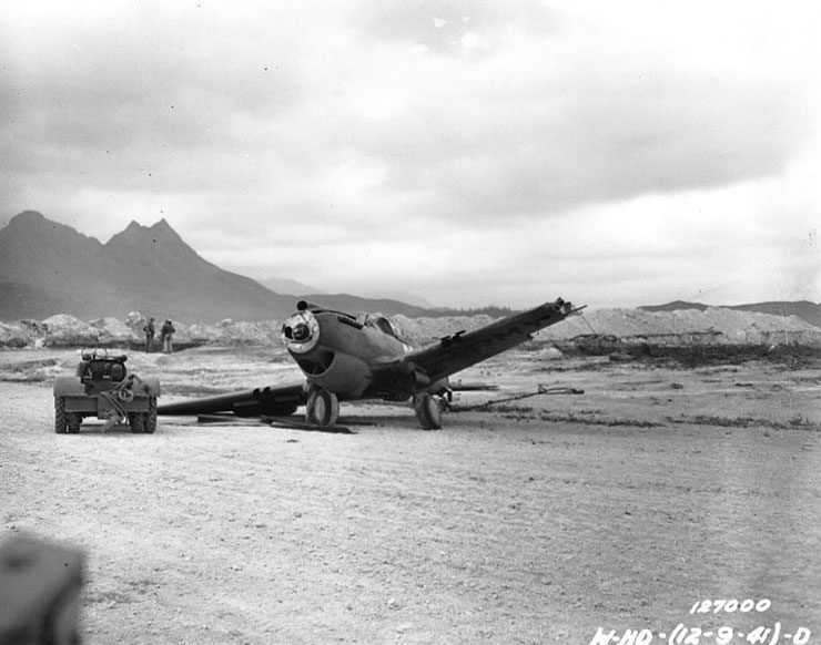 P-40 Warhawk aircraft damaged in a taxiing accident with another P-40 at Bellows Field, Oahu, US Territory of Hawaii, 8 Dec 1941, photo 3 of 3