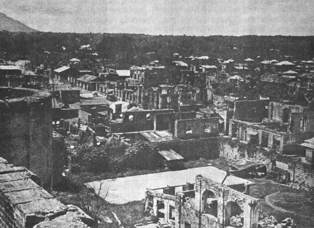 Destroyed buildings of Lipa City, Luzon, Philippine Islands, after 29 Mar 1945