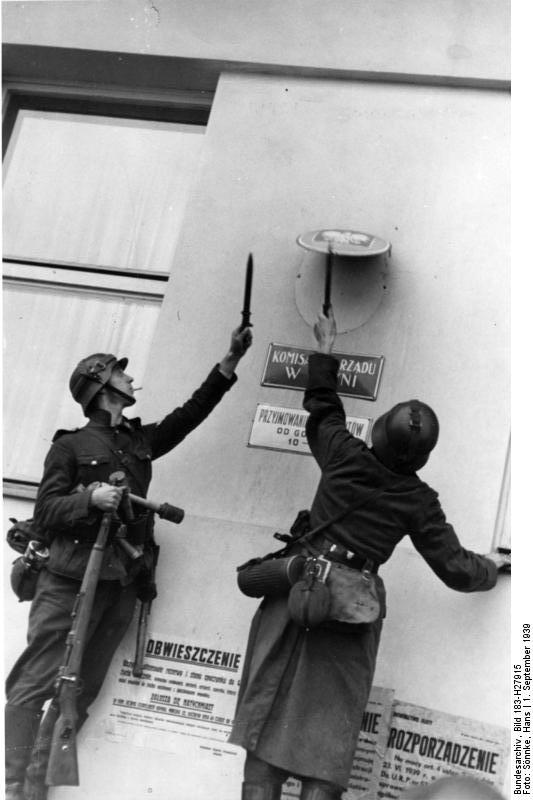 German troops removing the Polish emblem from the wall of a post office in Danzig, 1 Sep 1939