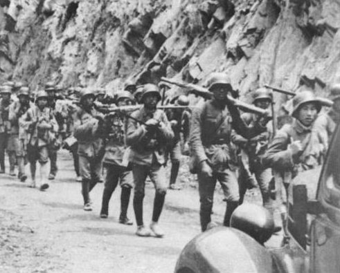 Troops of the Chinese 88th Division marching toward Shanghai, China, circa early Aug 1937; note German M1935 helmets